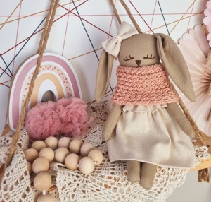 Cuddly bunny doll in a sweater and linen skirt